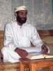 220px-Anwar_al-Awlaki_sitting_on_couch,_lightened.jpg