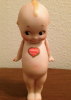 German_Kewpie_with_Heart_Sticker.png