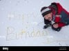 happy-birthday-written-in-the-snow-by-a-man-weeing-B85Y6M.jpg