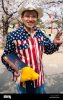 smiling-japanese-man-posing-under-cherry-blossoms-in-japan-wears-stars-EWKTF7.jpg